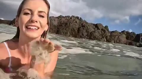 Influencer Michelle Sky goes viral after swimming in what she thought was sea foam.
