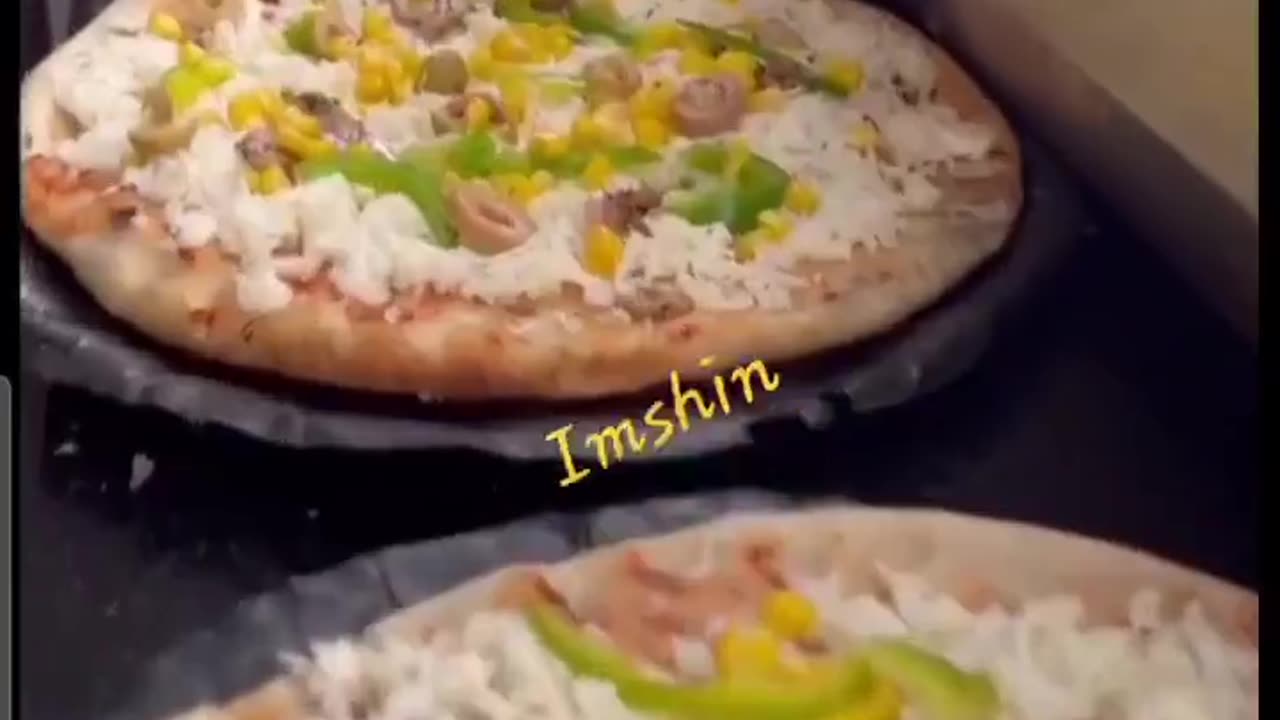 Preparing pizzas at Thailandi Restaurant, Gaza City.