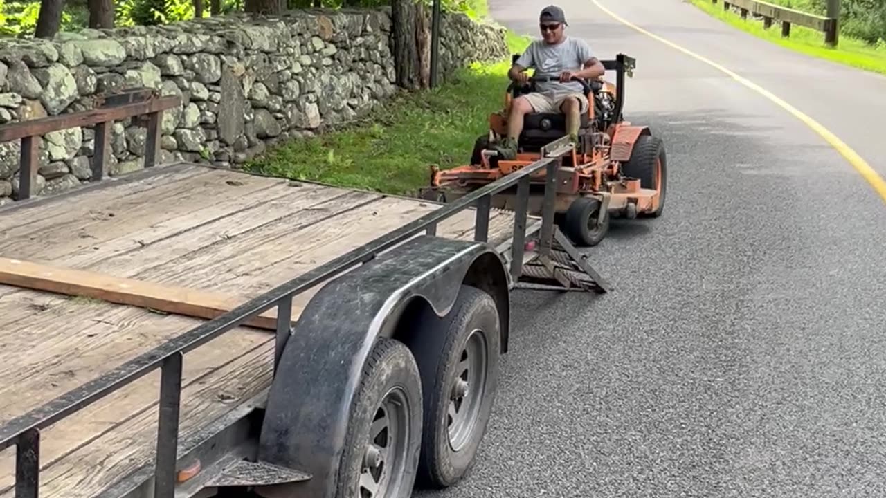 Mower Does a Wheelie Off the Trailer