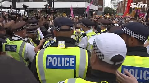 Migrant hotel residents ‘blow kisses’ from window as they film violent clashes on street