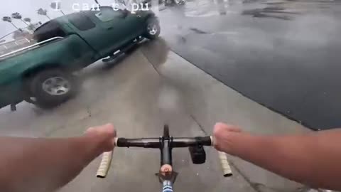 Bicyclist driving too fast to avoid hitting pickup truck. reckless driving