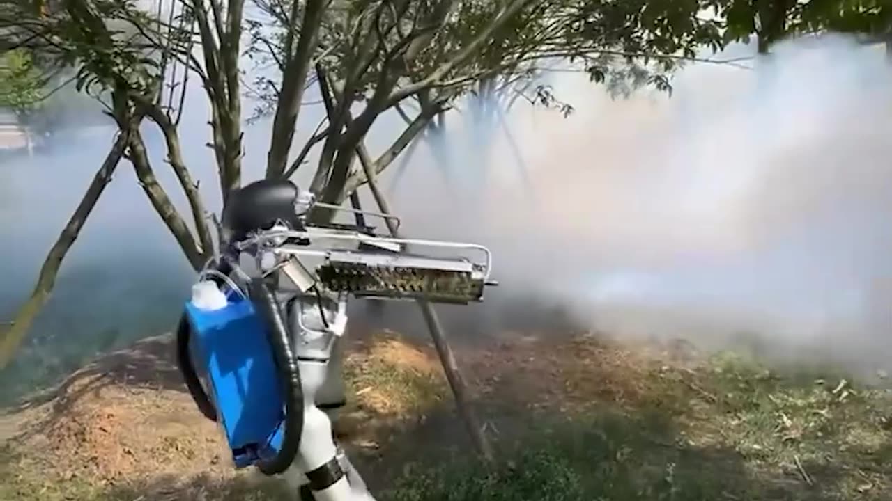 (China) - A robot sprays an entire field
