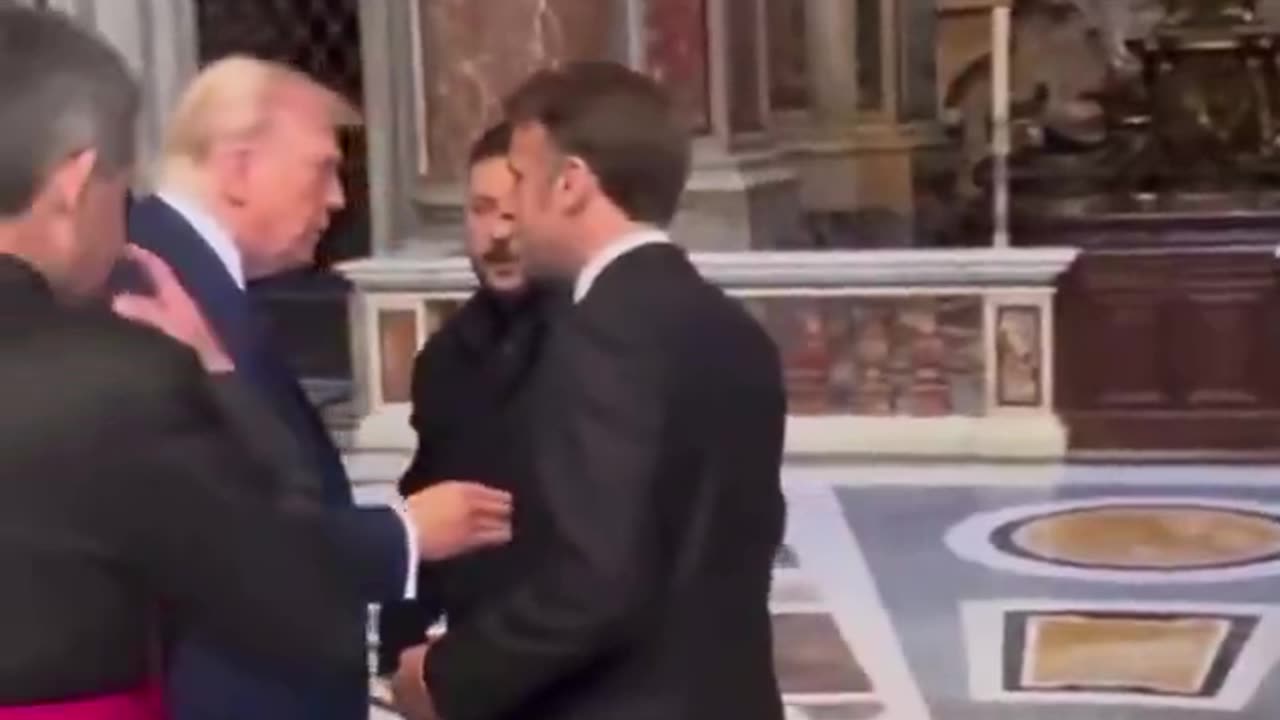 Macron shook one hand.