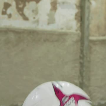 Freestyle soccer player doing skillful tricks with the ball