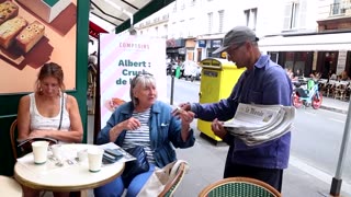 France's Macron to honor Paris' last known newspaper hawker