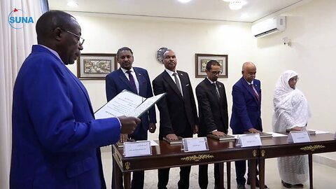 A number of ministers take the oath before the President of the Sovereign Council