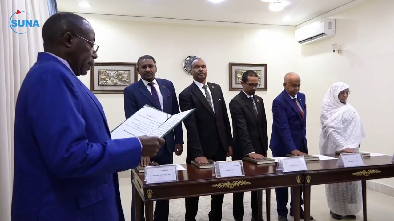 A number of ministers take the oath before the President of the Sovereign Council