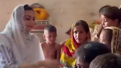 Female Assistant commissioner meet with children