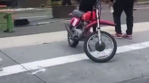 LA protests. Rock thrower was riding a red dirt bike.