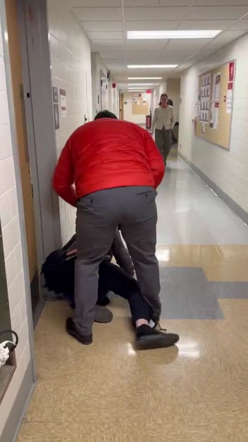 An Ohio State professor, Luke Perez, has been suspended after allegedly assaulting a cameraman