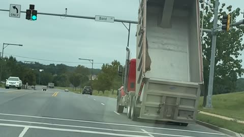 Dump Truck Collides With Traffic Light