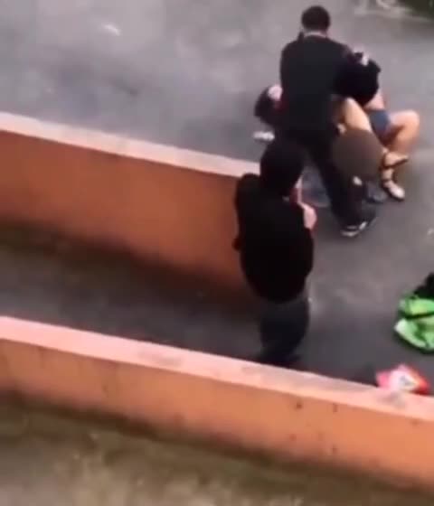 Woman Fighting Off Attack Outside of College Campus in Kazan, Russia as People Watch