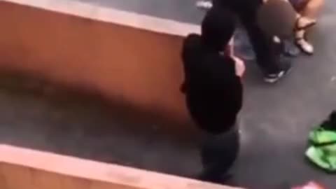 Woman Fighting Off Attack Outside of College Campus in Kazan, Russia as People Watch