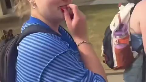 Student at University of Oklahoma tramples on TPUSA signs.