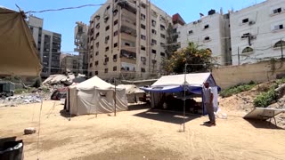 Gazan father wheels disabled child as families flee Israeli attacks