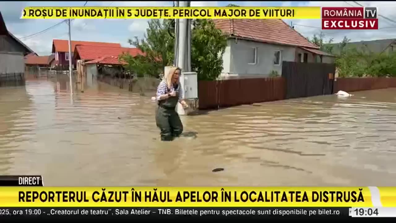 Romanian journalist falls into hole while filming report on flood-stricken region