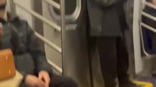 Man on NYC subway stands up to another man harassing passengers