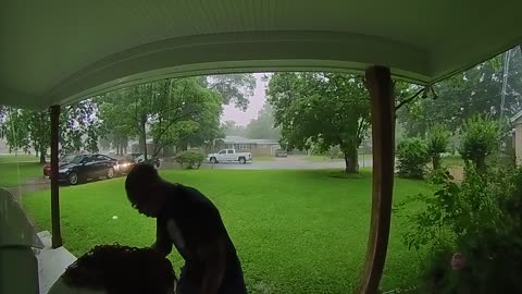Woman Takes Fall After Hurrying in From The Rain