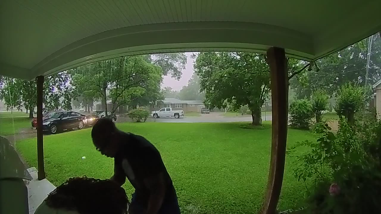 Woman Takes Fall After Hurrying in From The Rain
