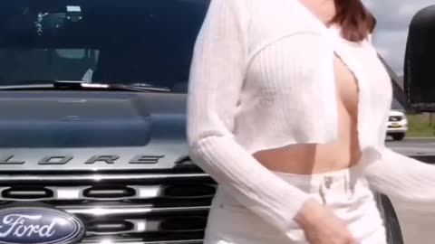 Just showing herself at a parking lot