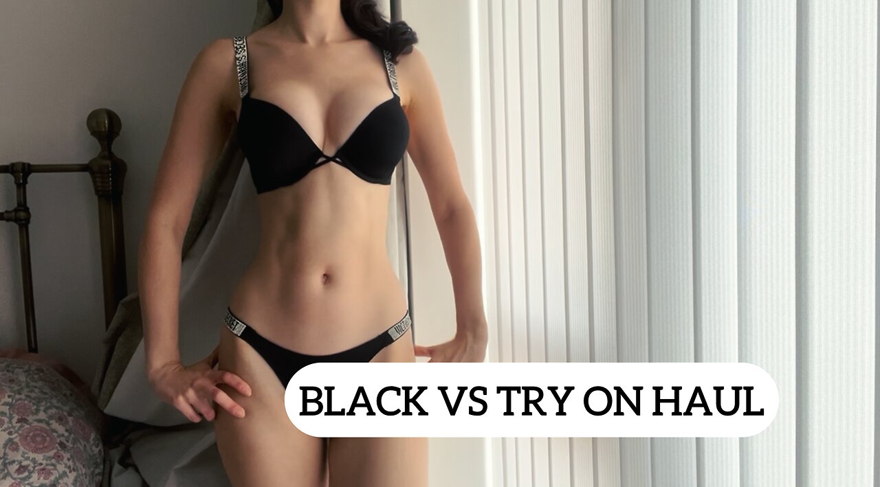 trying on Victoria’s Secret black lingerie