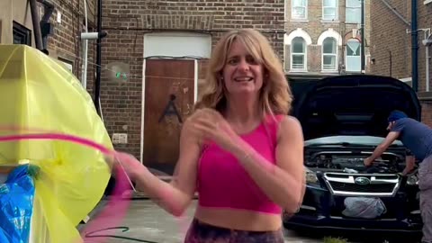 Woman Spins Hula Hoop On Breasts
