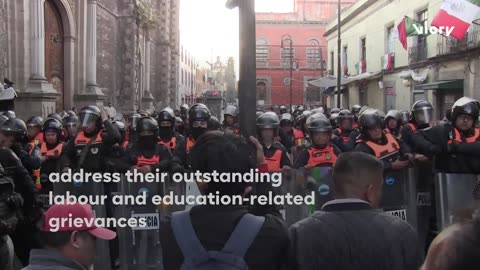 Police tear gas TEACHERS at Mexico City's National Palace as 48-hour strike kicks off