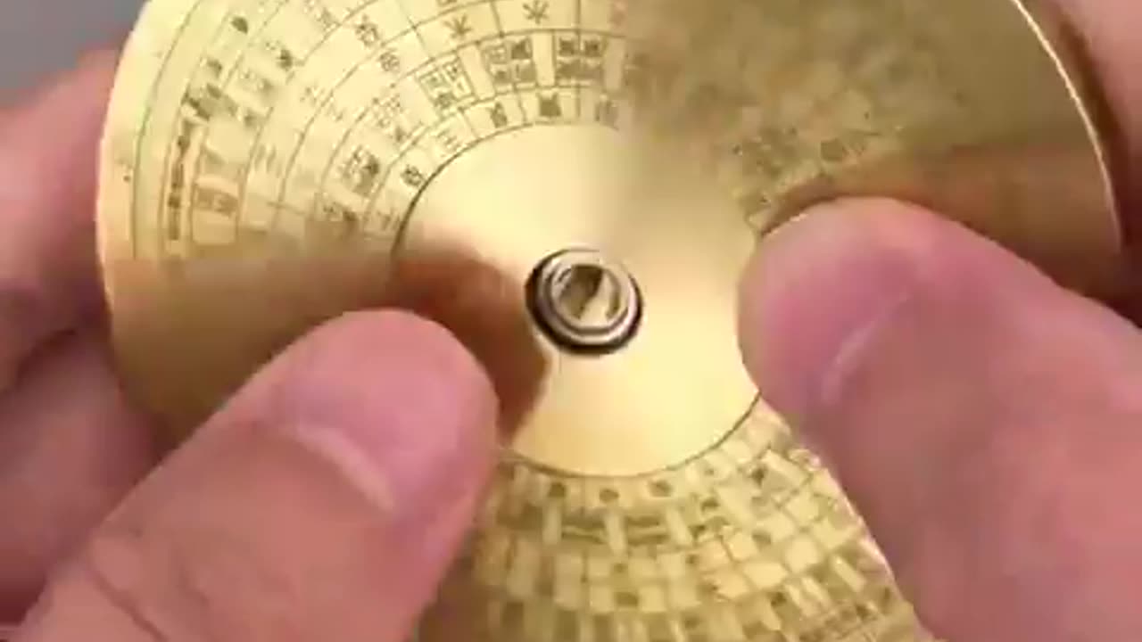 THIS IS THE LUO PAN, A CHINESE COMPASS USED IN FENG SHUI TO FIND DIRECTIONS AND HARMONIZE ENERGIES