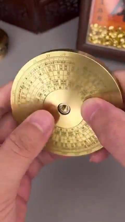 THIS IS THE LUO PAN, A CHINESE COMPASS USED IN FENG SHUI TO FIND DIRECTIONS AND HARMONIZE ENERGIES