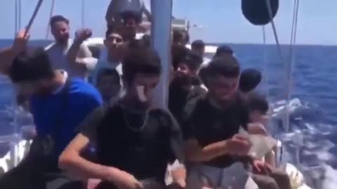 MEANWHILE SOMEWHERE ON THE SEA ON THEIR WAY TO UK ENGLAND OUR LATEST BATCH OF RAPISTS MURDERERS