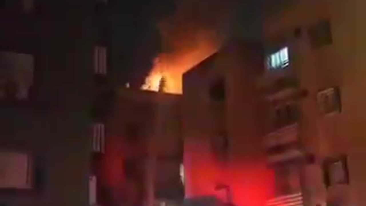 Building on fire in Holon, Israel after Iranian missile attack; no word on injuries.