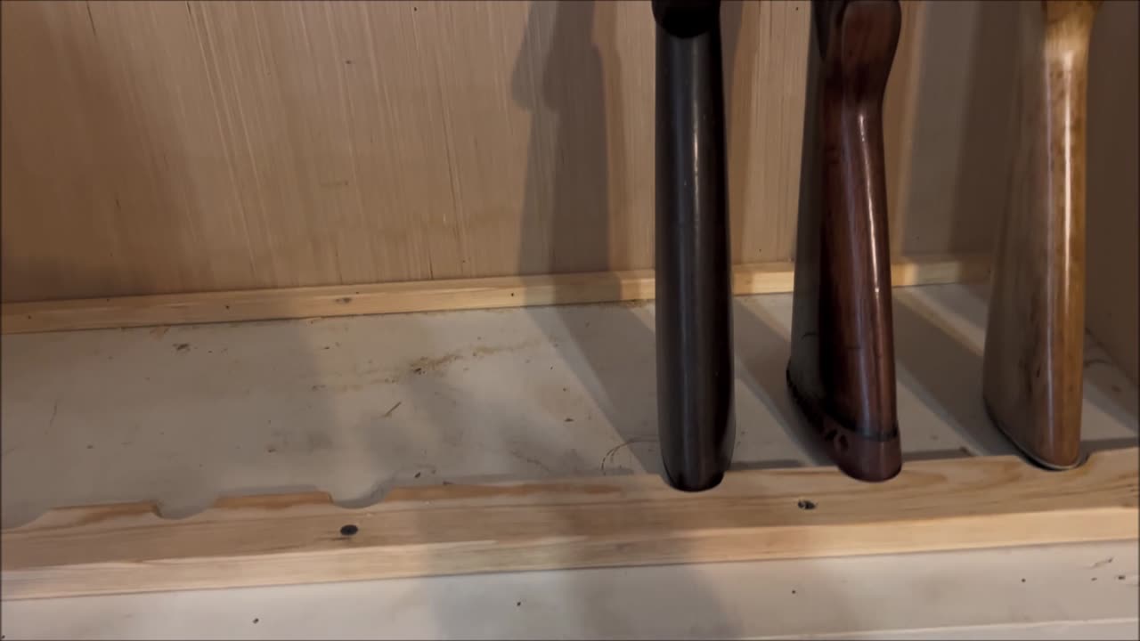 converted book case to rifle rack