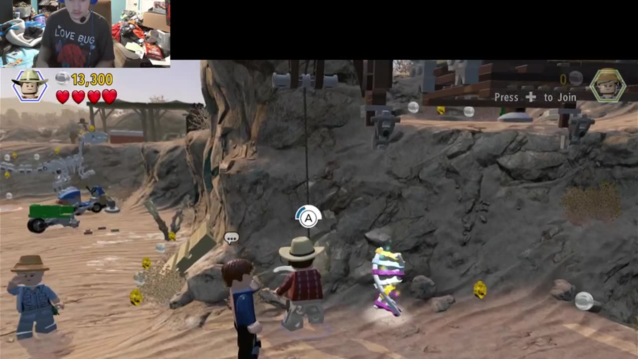 Carson gaming play Lego Jurassic world