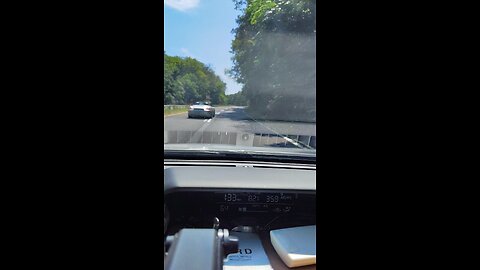 Empty Taconic following a Porsche convertible