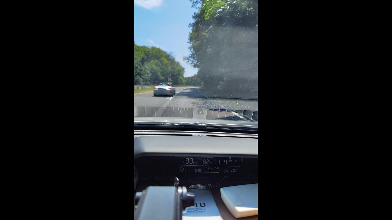 Empty Taconic following a Porsche convertible