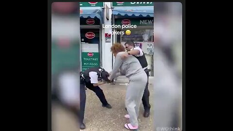 Two cops in London can't subdue and arrest a lady in pink socks and flip flops.
