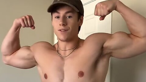 Young man flexing muscles
