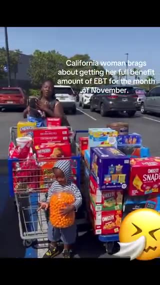 Woman has her child pose as she shows off carts full of groceries she bought using her November EBT