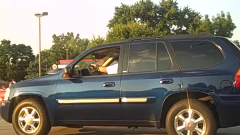 dog with sun glasses , while riding in my 73 Eldorado on the shea show