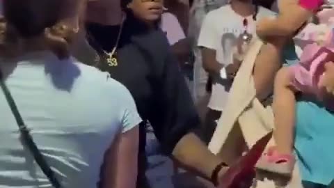 Woman screams at a child in stroller outside Kamala Harris rally