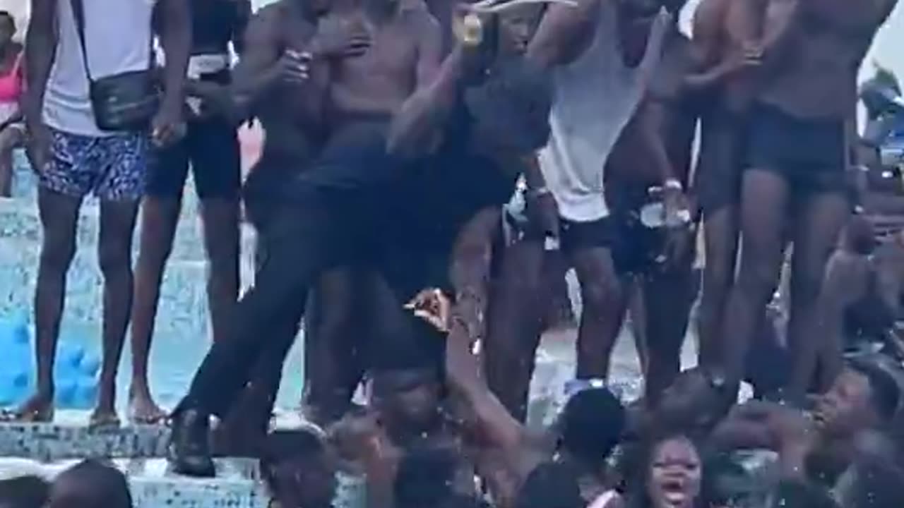 The crowd tries to abuse a woman.