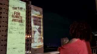 Climate activists project message to 'rich polluters' in Belem