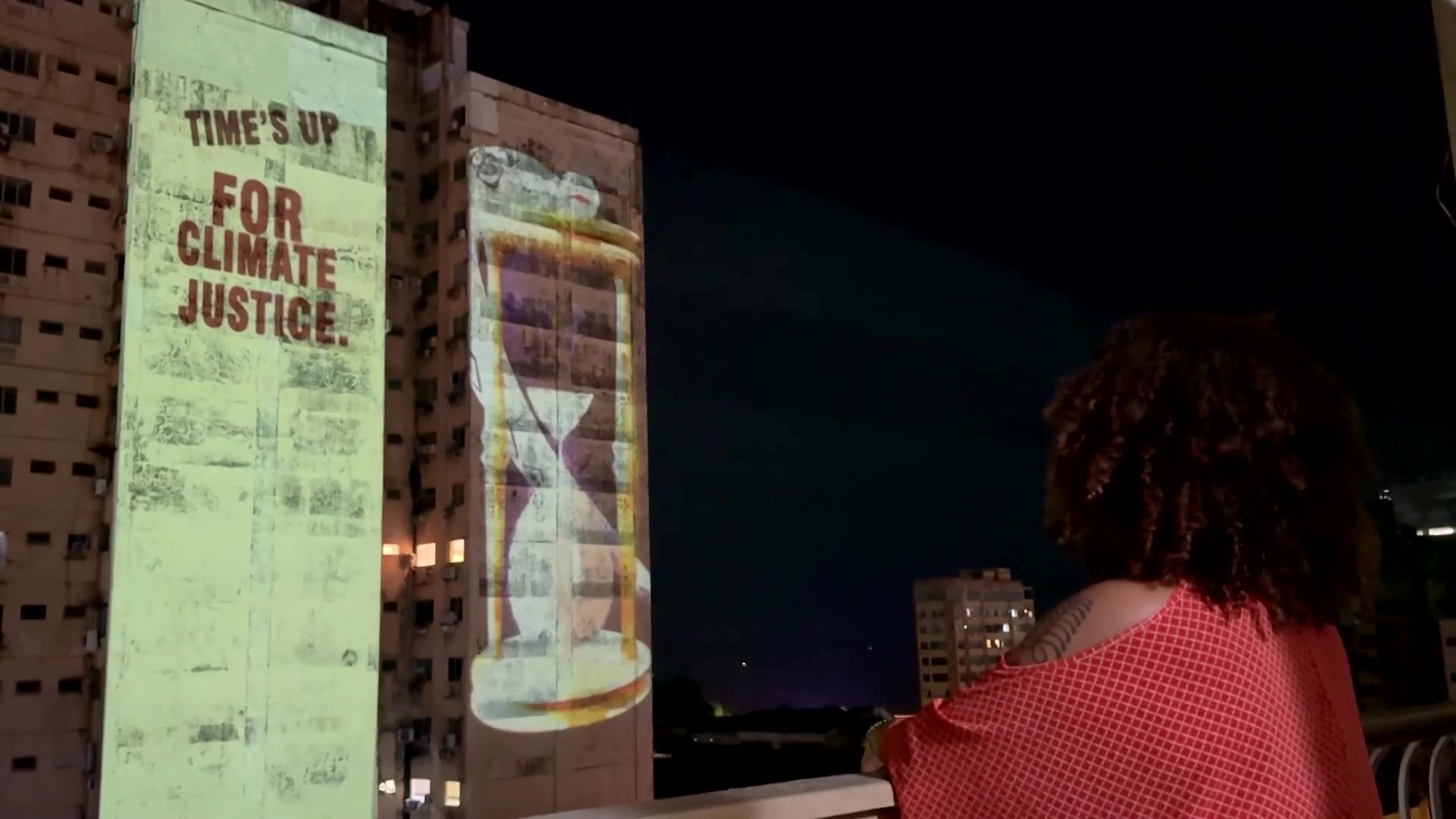 Climate activists project message to rich polluters in Belem