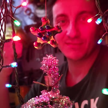A DIY Christmas tree star made from a bicycle chain.
