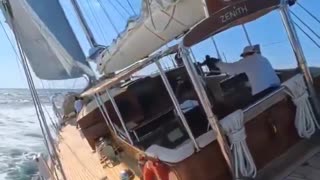 Sailboat heels sharply in mid-sail