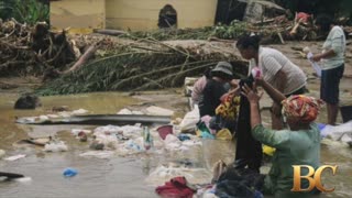 Desperate hunt for food and water as Indonesia floods death toll rises to 442