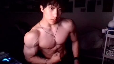 19 years old bodybuilder flexing muscles