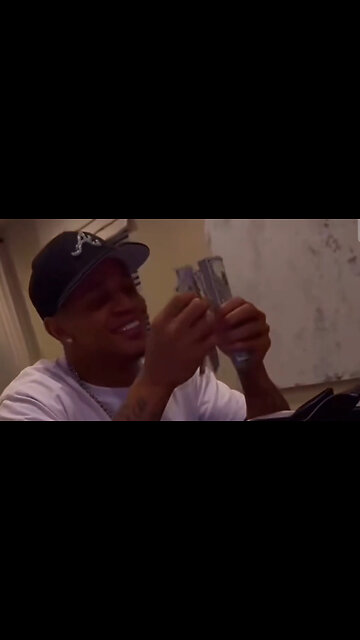 YK Osiris shows off the check he got for getting beat up