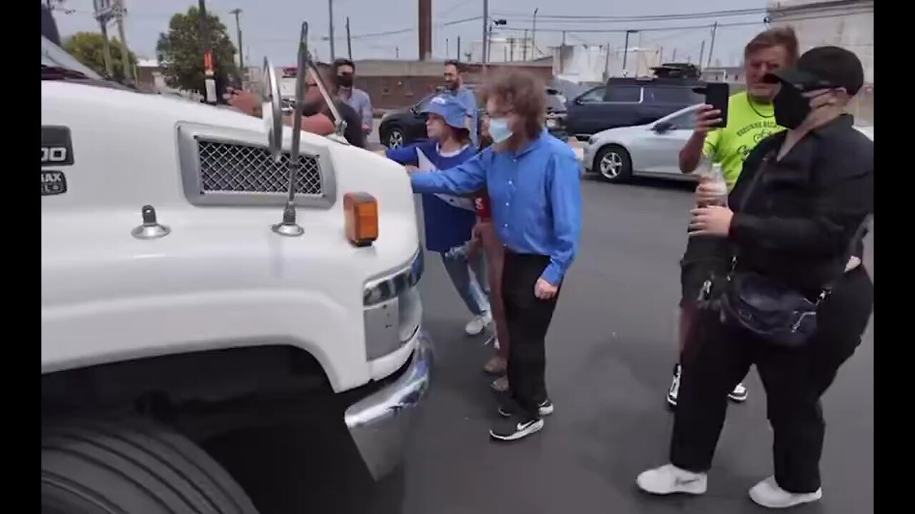 White liberal throws herself in front of a truck in New Jersey, screaming "let my people go."
