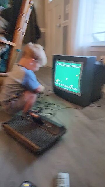 Two year old Playing Stampede on Atari